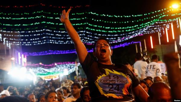 Supporters of Sri Lanka's president Ranil Wickremesinghe cheer during his final election campaign rally for the upcoming election, in Colombo, Sri Lanka, Sept. 18, 2024.